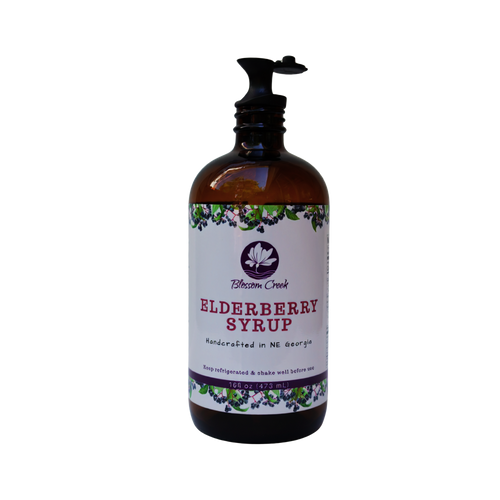 16 oz Blossom Creek Elderberry Syrup bottle with reusable black pour spout attached.