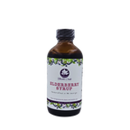 Front view of Blossom Creek 8 oz handcrafted Elderberry Syrup in an amber glass bottle with a white floral and elderberry label, made in North Georgia.