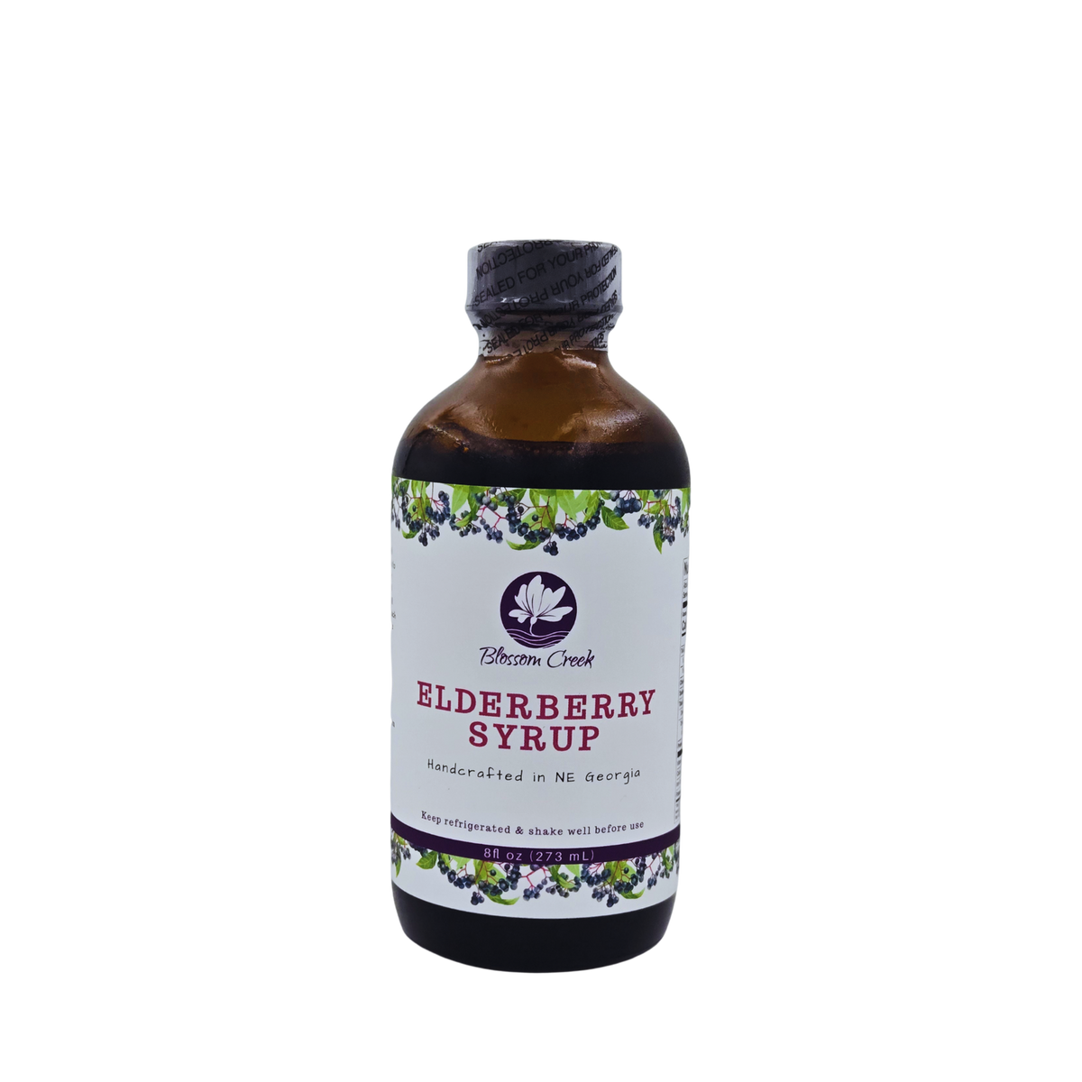 Front view of Blossom Creek 8 oz handcrafted Elderberry Syrup in an amber glass bottle with a white floral and elderberry label, made in North Georgia.
